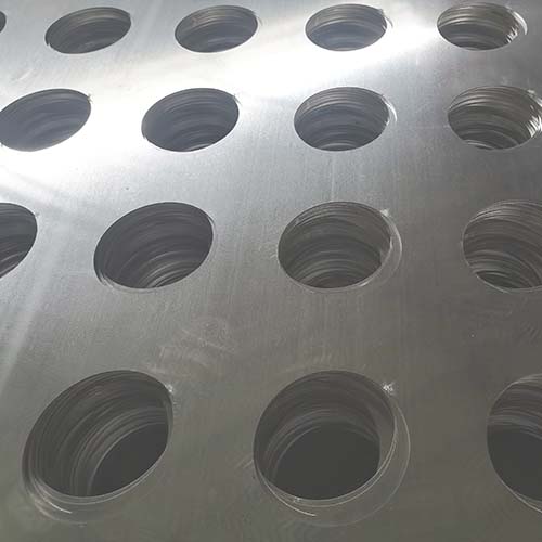 101 holes with 50 mm spacing arranged in a straight row on a round perforated plate